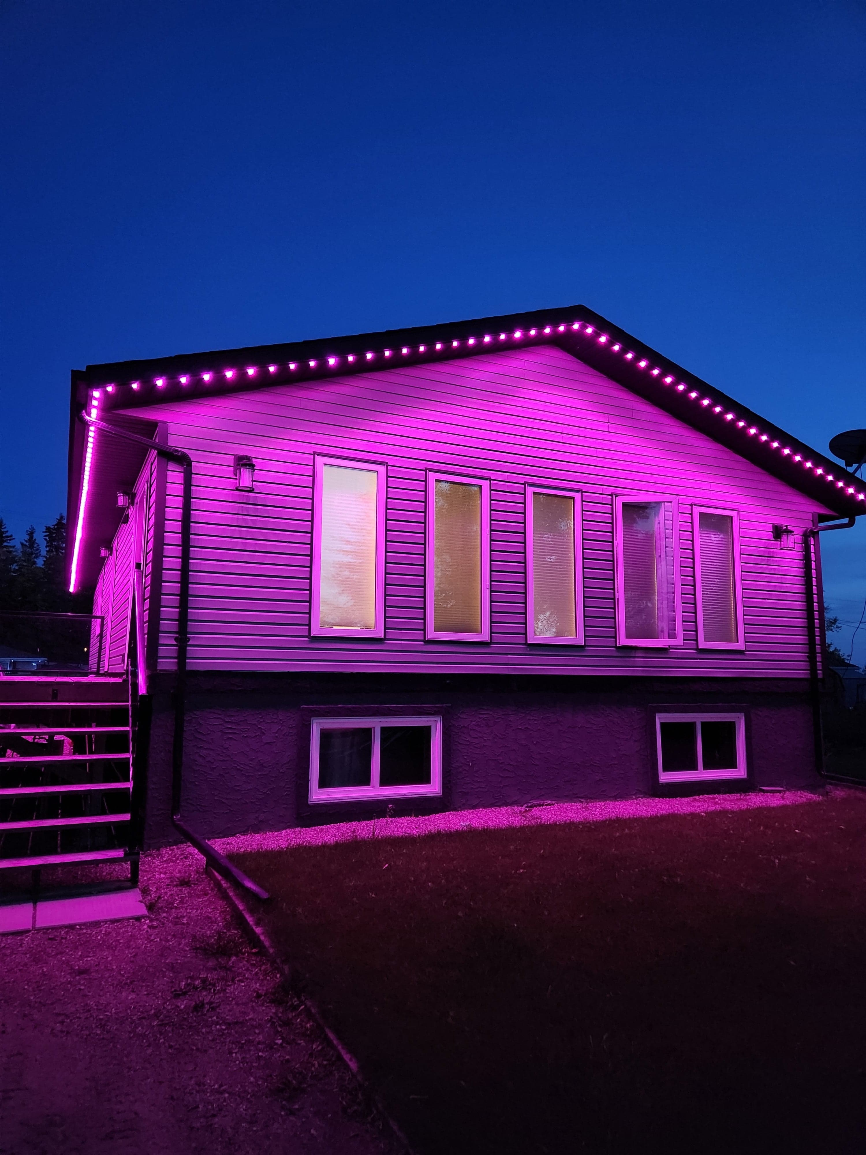 Same home with permanent LED lighting set to bright pink and magenta for Valentine's Day
